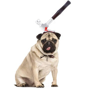 Pug wearing a Halloween pet headdress hat with a fake bloody hammer sticking out from its head costume.